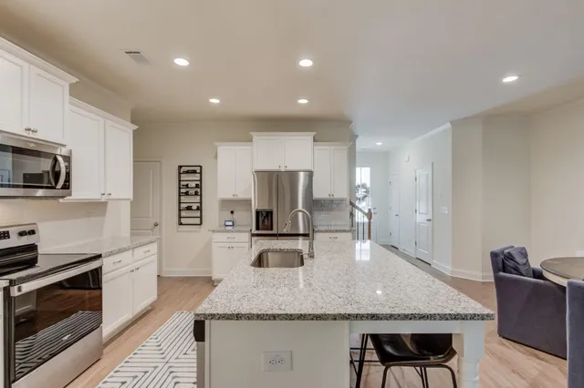 a view of a house with porch and garden