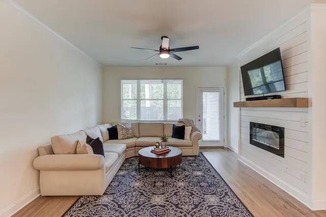 an outdoor sitting area with furniture and garden