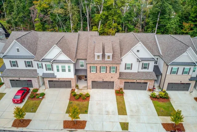 an empty room with closet and a ceiling fan