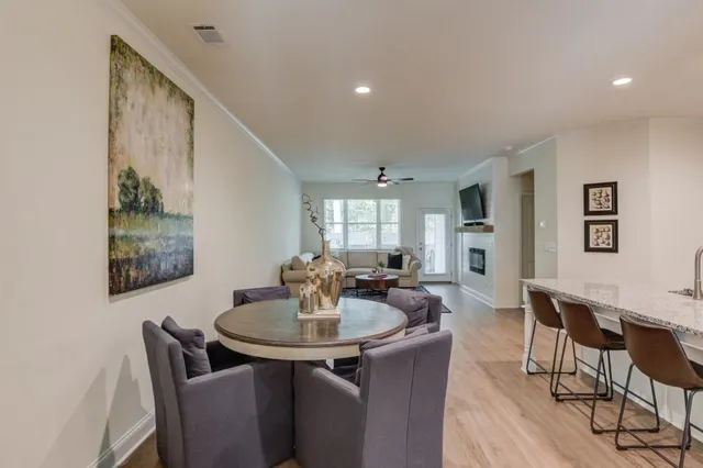 a view of a chairs and table in patio
