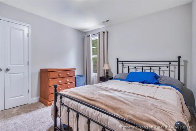 a view of a house with swimming pool and sitting area