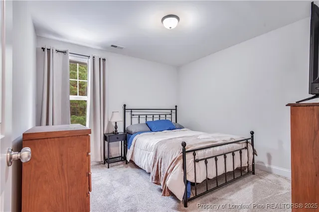 a view of a house with a backyard porch and sitting area