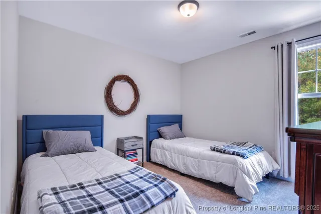 an aerial view of residential house with outdoor space and trees