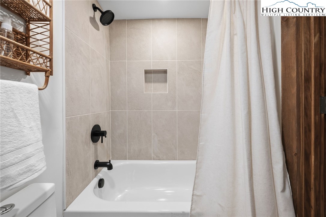 1520 Bamboo Road Boone, NC 28607 - Photo 34 of 41 a bathroom with a sink and a shower