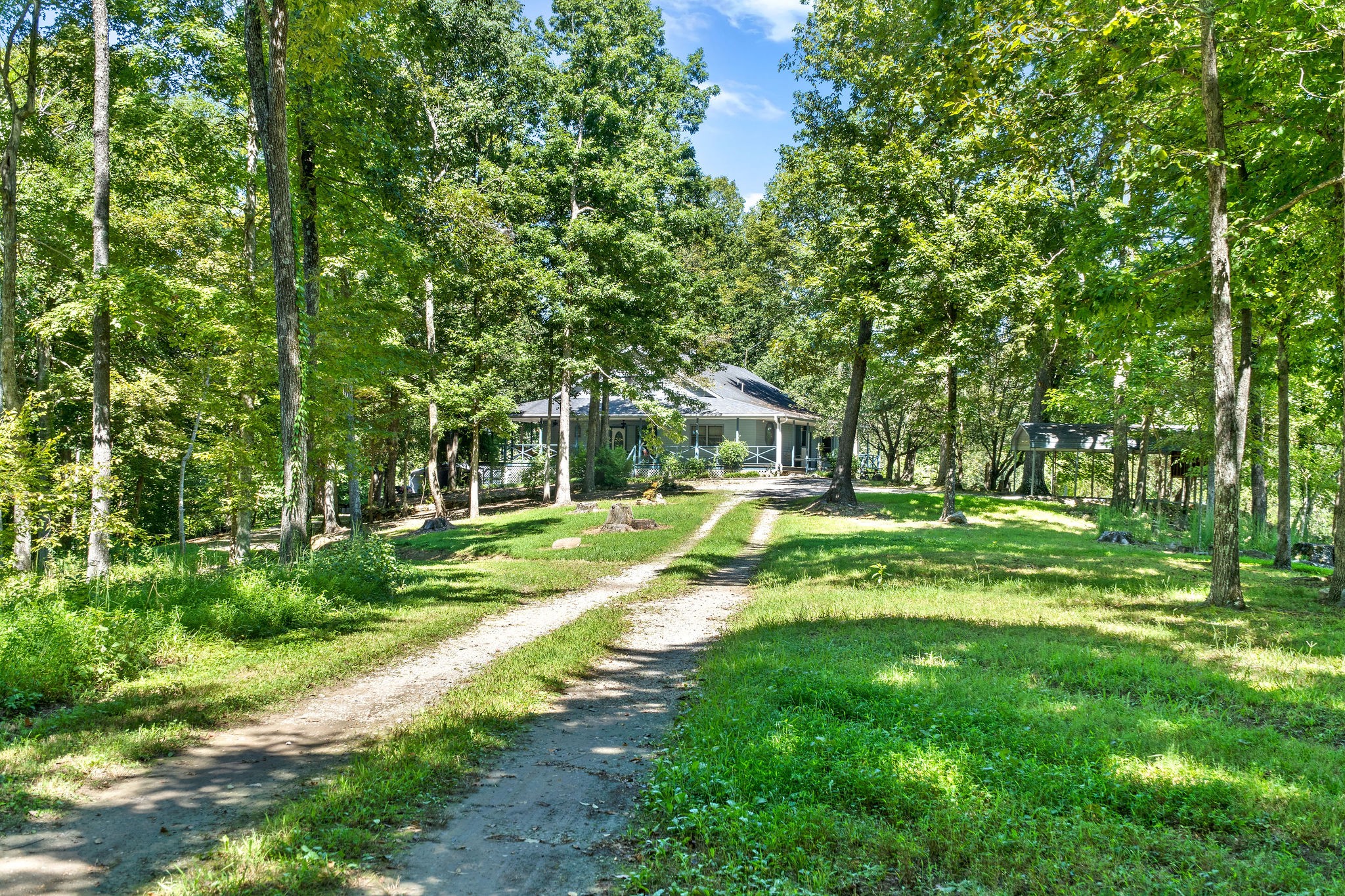 a view of house with backyard space and garden