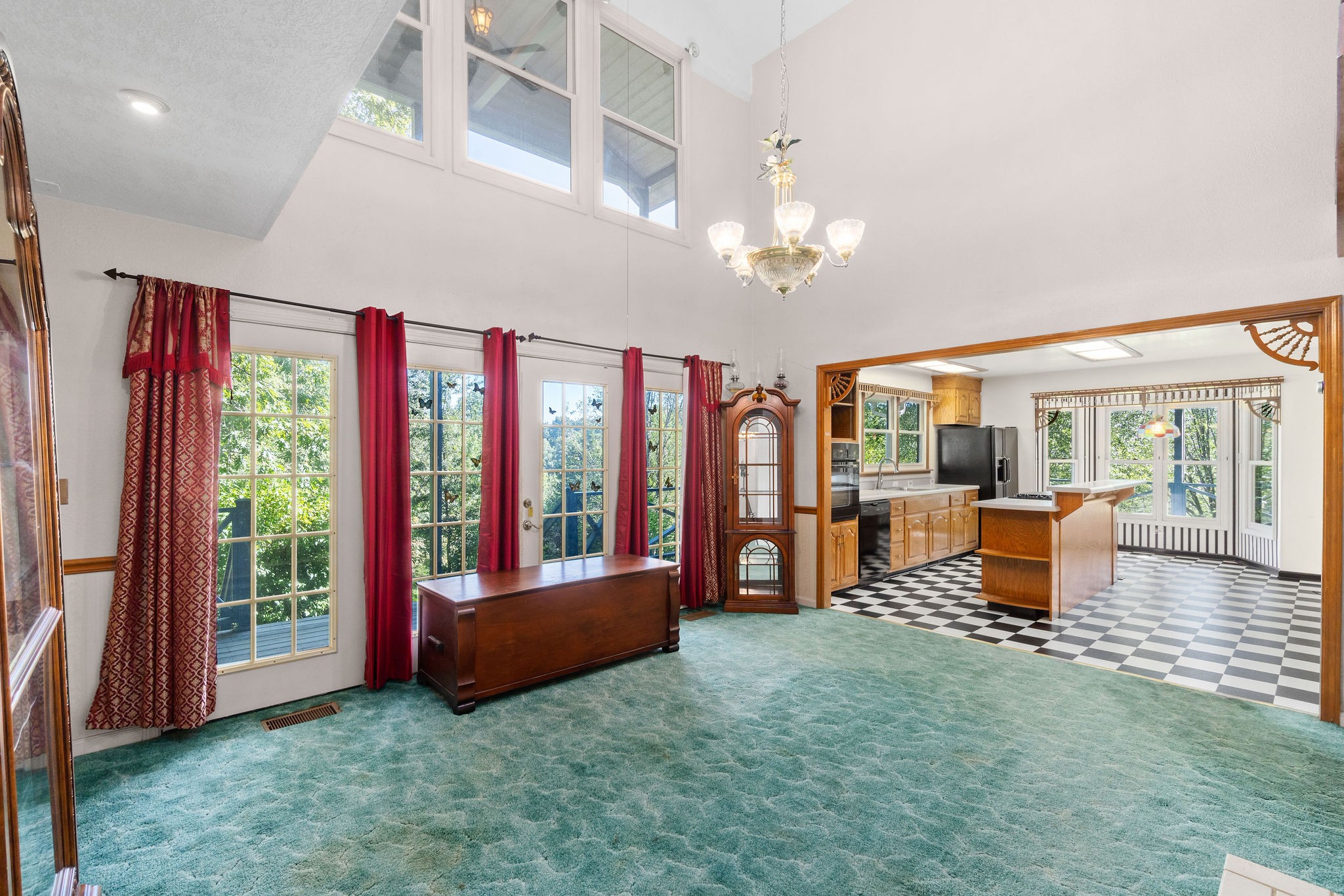 3250 Luther Ragan Road Palmyra, TN 37142 - Photo 11 of 44 a living room with furniture and a floor to ceiling window