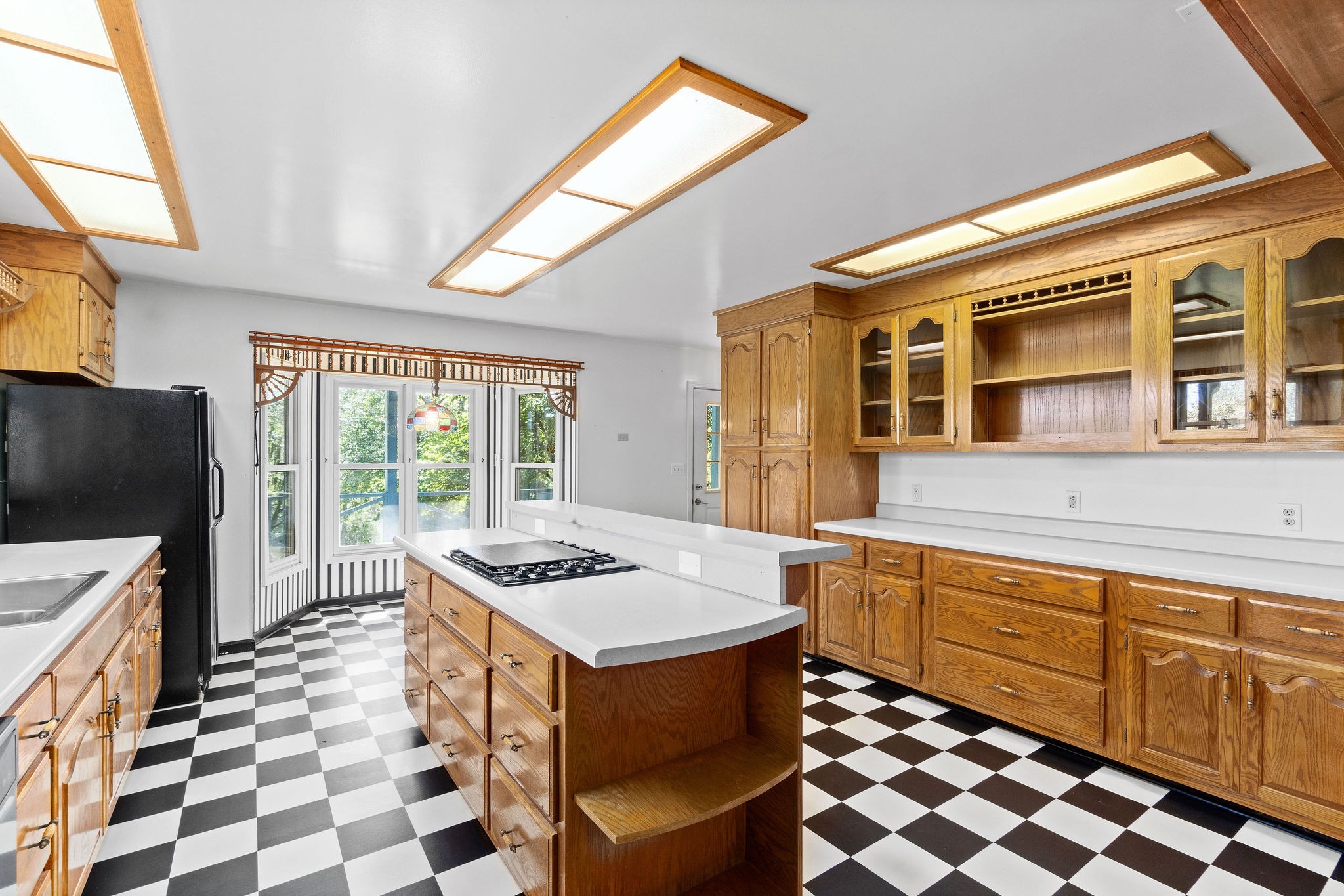 3250 Luther Ragan Road Palmyra, TN 37142 - Photo 14 of 44 a kitchen with stainless steel appliances a stove a sink and a microwave