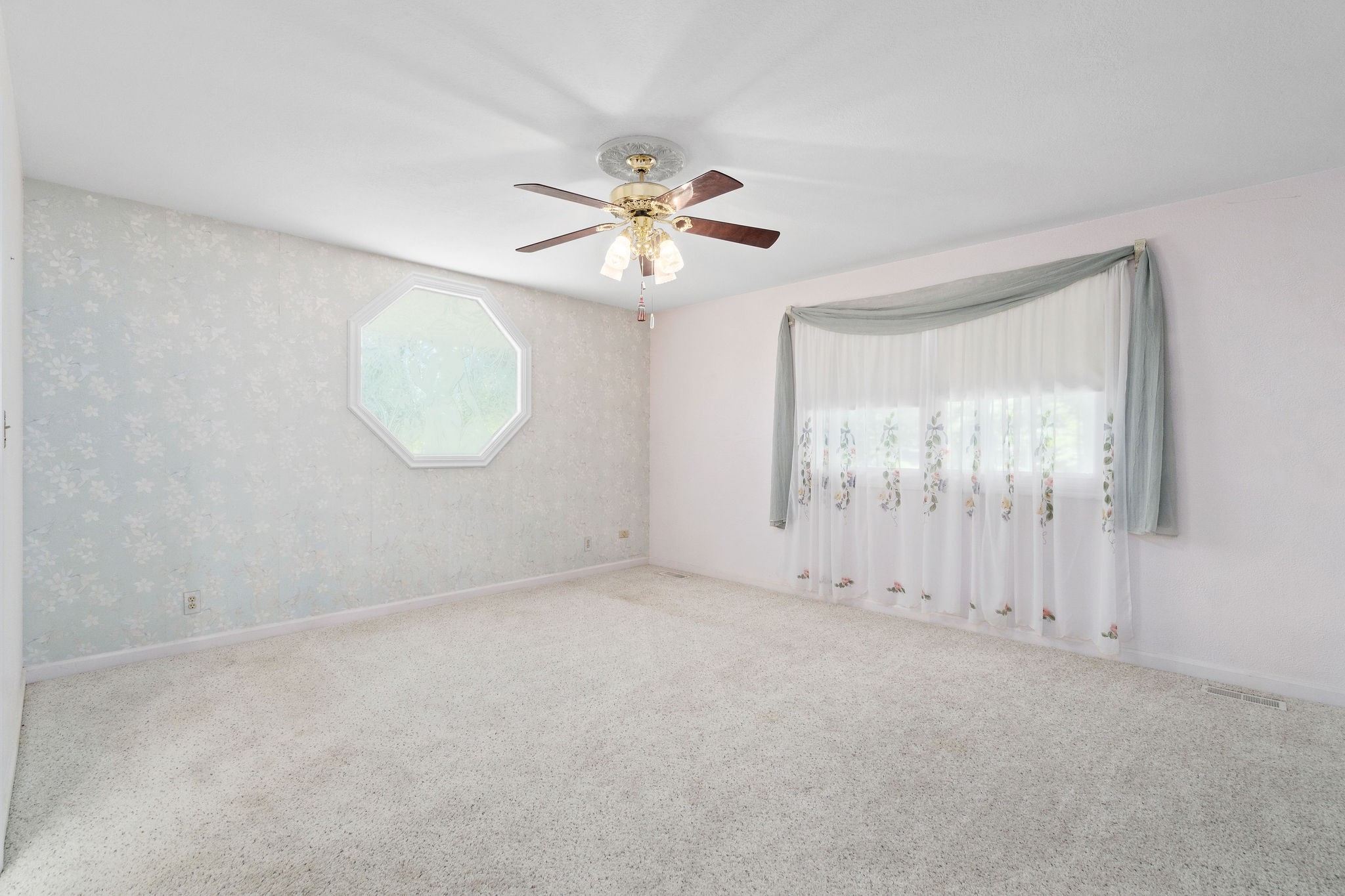 3250 Luther Ragan Road Palmyra, TN 37142 - Photo 17 of 44 an empty room with windows and fan