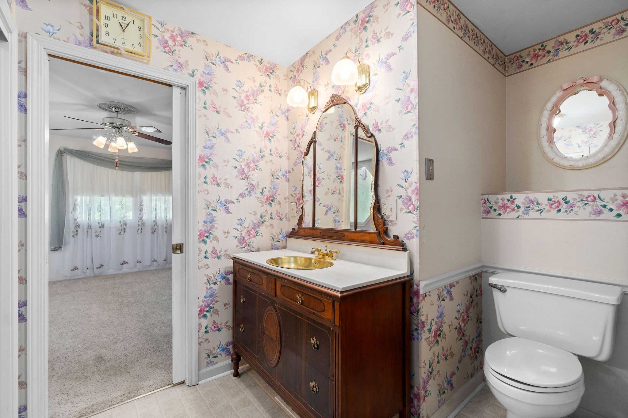 3250 Luther Ragan Road Palmyra, TN 37142 - Photo 20 of 44 a bathroom with a sink toilet vanity and shower