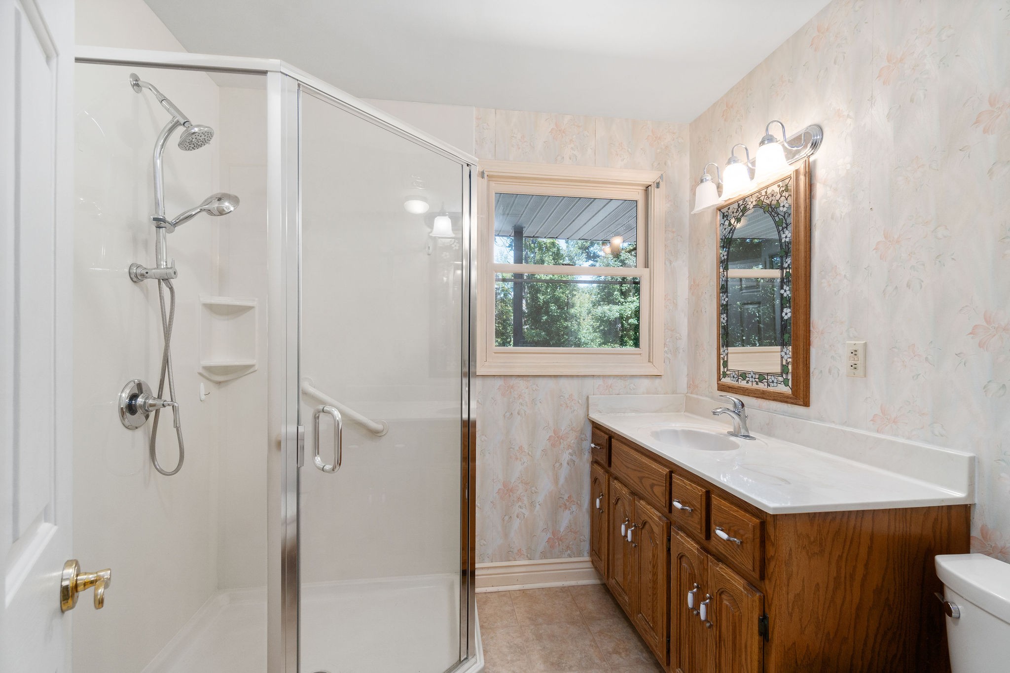 3250 Luther Ragan Road Palmyra, TN 37142 - Photo 24 of 44 a bathroom with a double vanity sink and large mirror