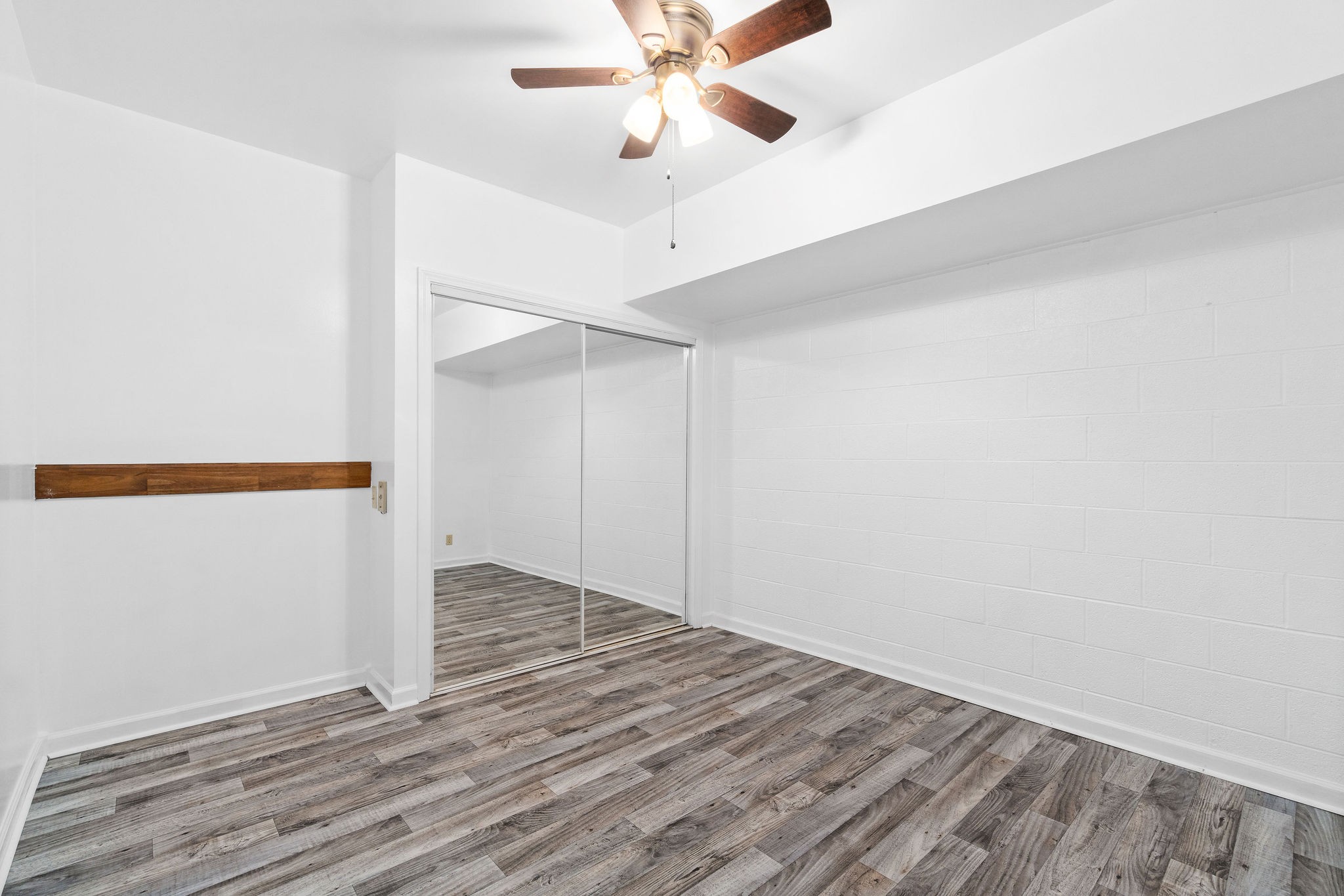 3250 Luther Ragan Road Palmyra, TN 37142 - Photo 31 of 44 wooden floor in an empty room