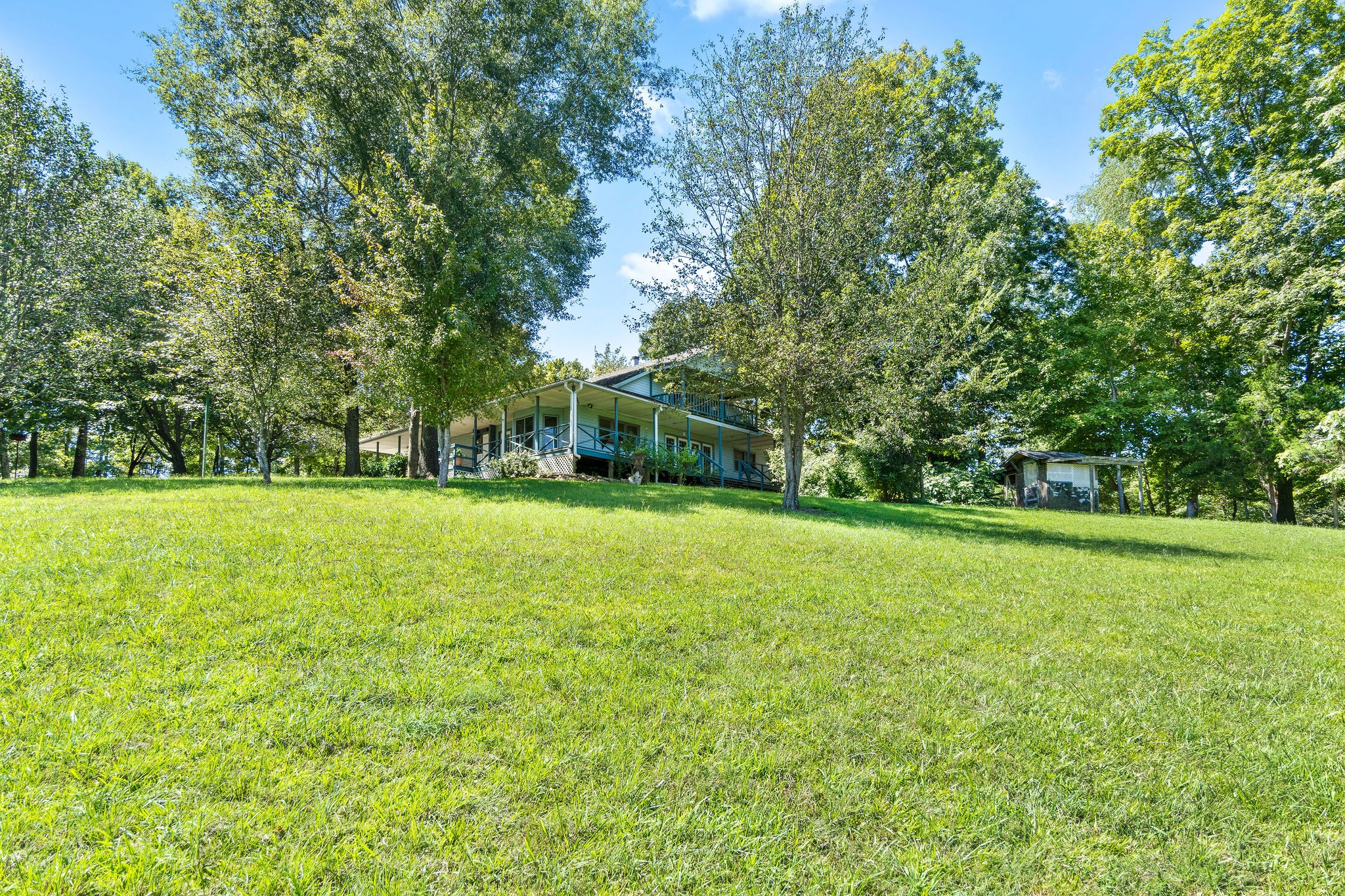3250 Luther Ragan Road Palmyra, TN 37142 - Photo 35 of 44 a view of outdoor space with deck and trees