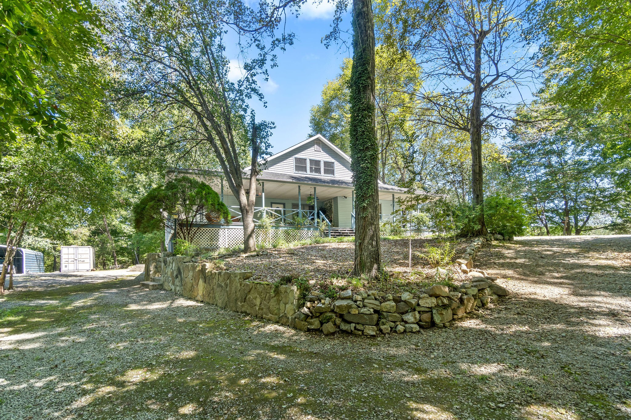 3250 Luther Ragan Road Palmyra, TN 37142 - Photo 37 of 44 a front view of a house with a garden