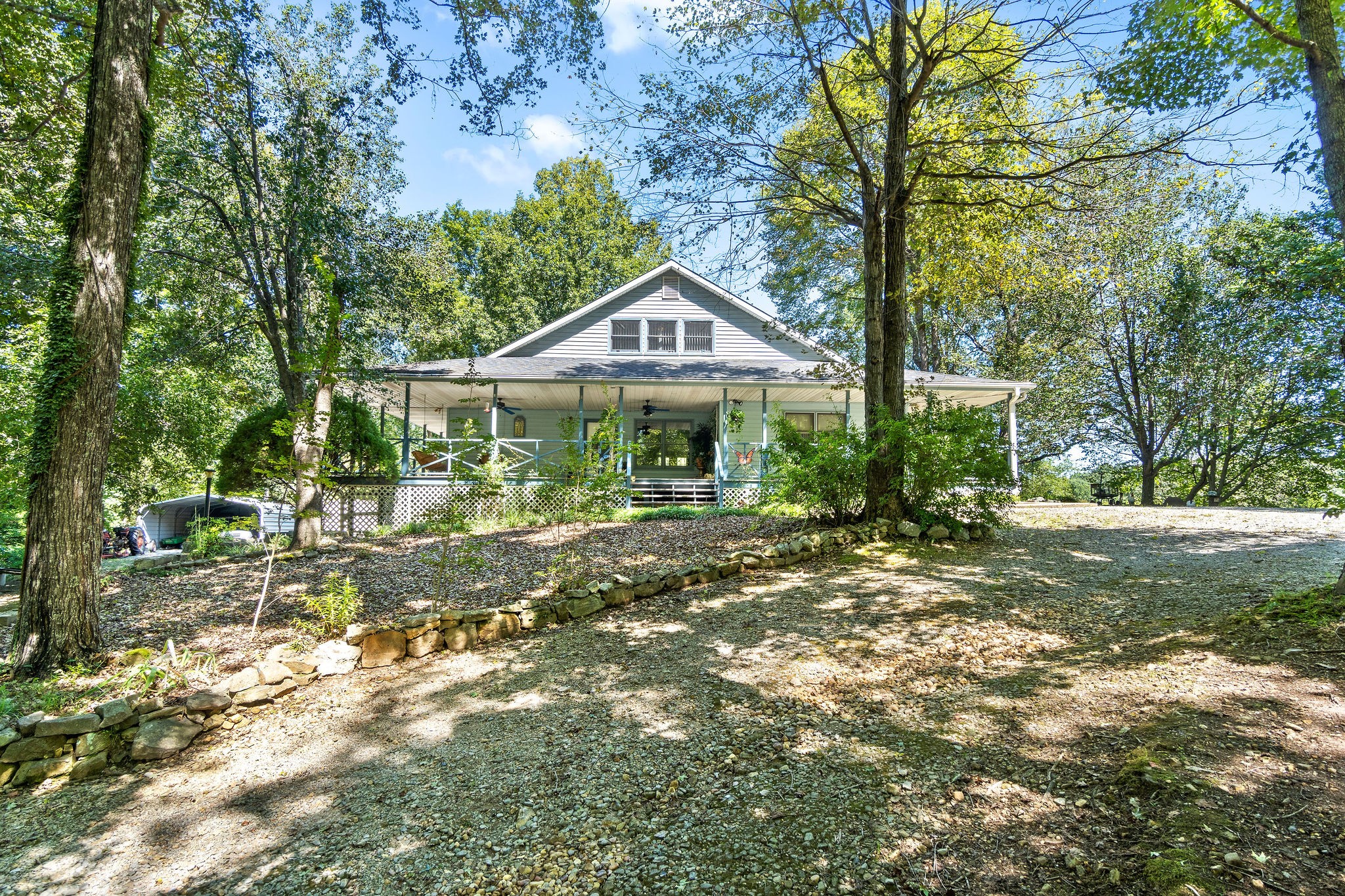 3250 Luther Ragan Road Palmyra, TN 37142 - Photo 38 of 44 a front view of a house with garden