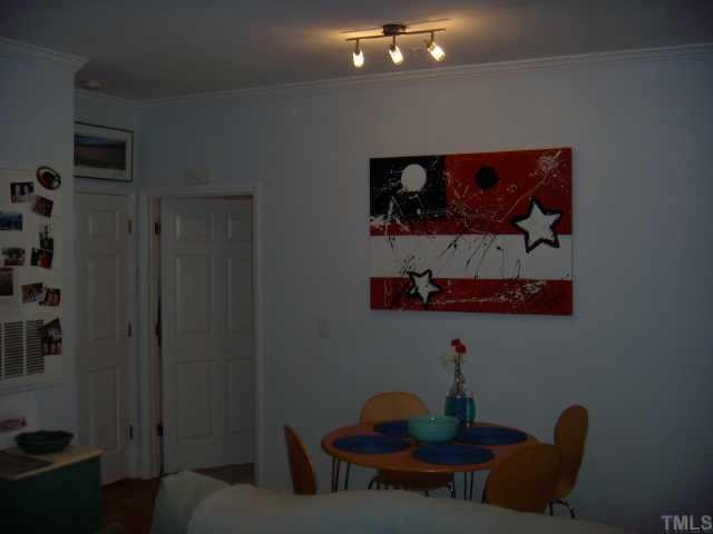 720 North Person Street, Unit 105 Raleigh, NC 27604 - Photo 6 of 8 a room with furniture and a potted plant