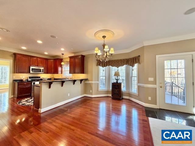 4605 Blue Run Road Somerset, VA 22972 - Photo 11 of 56 a large kitchen with stainless steel appliances granite countertop a large counter top a stove and a wooden floors