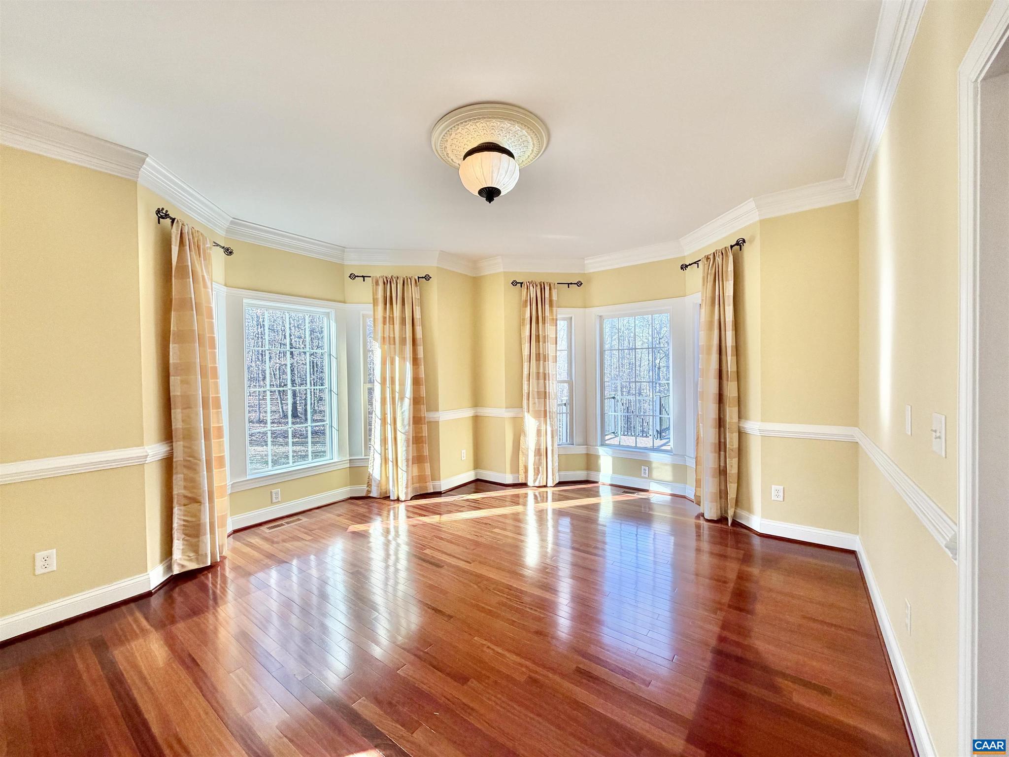 4605 Blue Run Road Somerset, VA 22972 - Photo 8 of 56 a view of an empty room with wooden floor and a window