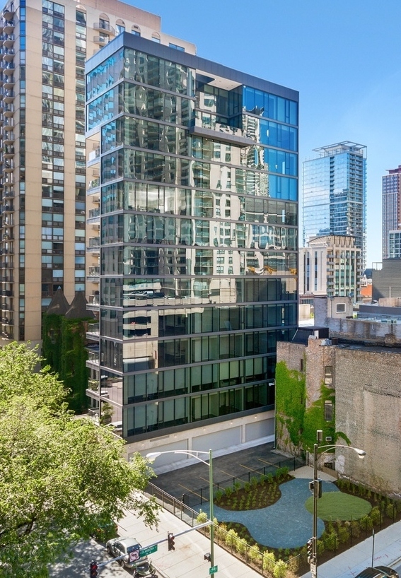 56 West Huron Street, Unit 6 Chicago, IL 60654 - Photo 1 of 32 a view of a tall building