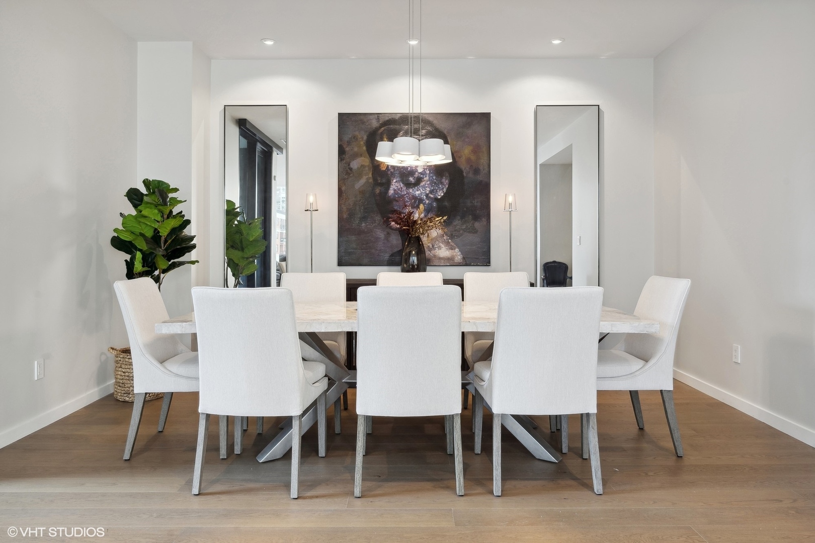 56 West Huron Street, Unit 6 Chicago, IL 60654 - Photo 14 of 32 a dining room with furniture and wooden floor