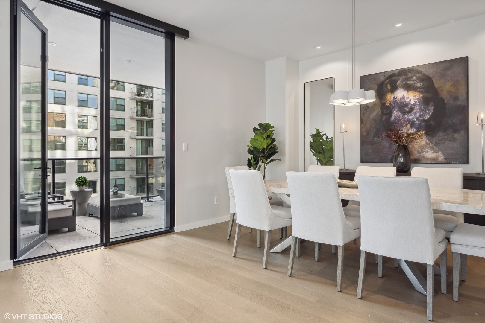 56 West Huron Street, Unit 6 Chicago, IL 60654 - Photo 15 of 32 a view of a dining room with furniture window and wooden floor
