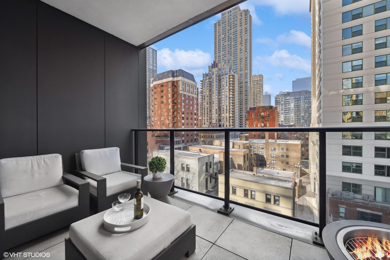 56 West Huron Street, Unit 6 Chicago, IL 60654 - Photo 17 of 32 a living room with furniture and a floor to ceiling window