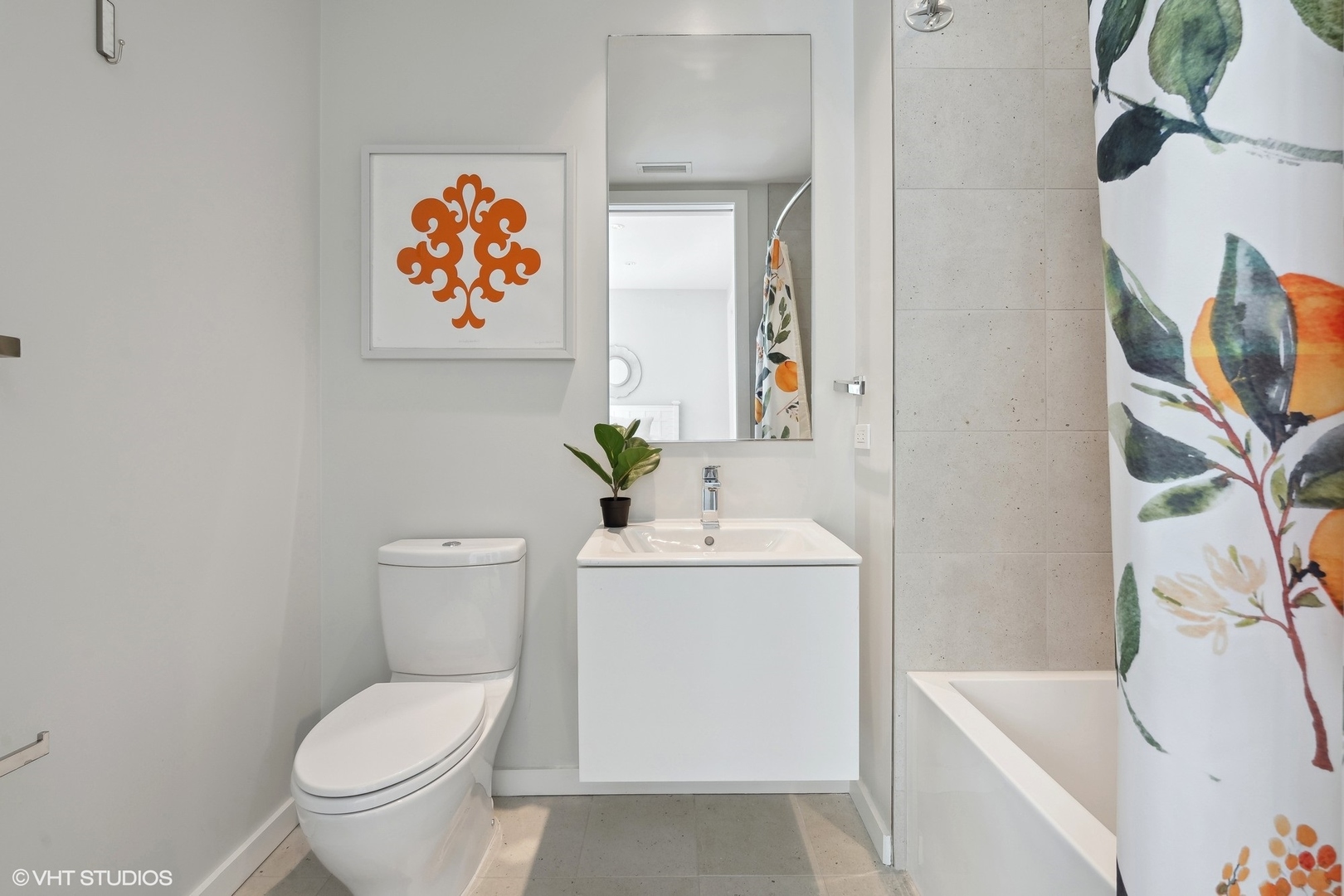 56 West Huron Street, Unit 6 Chicago, IL 60654 - Photo 21 of 32 a white toilet sitting next to a bathroom sink