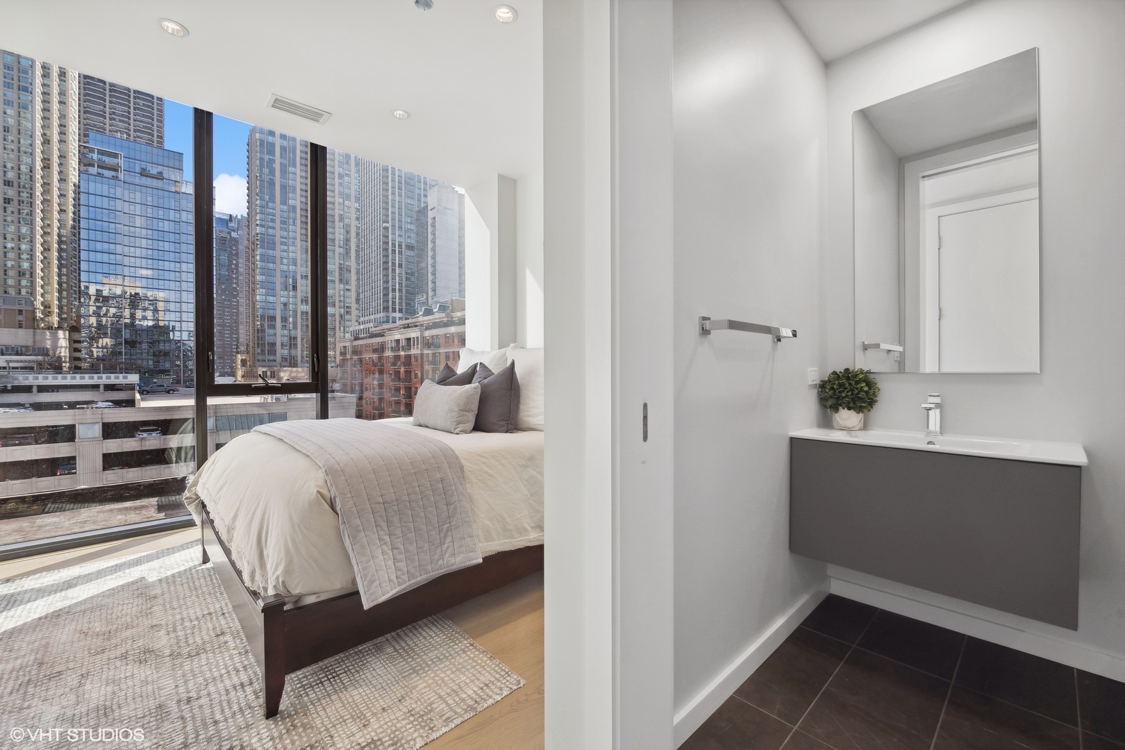 56 West Huron Street, Unit 6 Chicago, IL 60654 - Photo 23 of 32 a bedroom with a bed and a window
