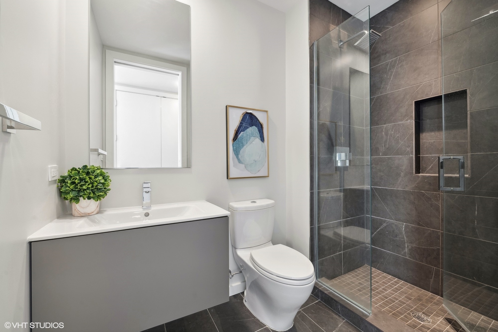 56 West Huron Street, Unit 6 Chicago, IL 60654 - Photo 24 of 32 a bathroom with a sink toilet and shower