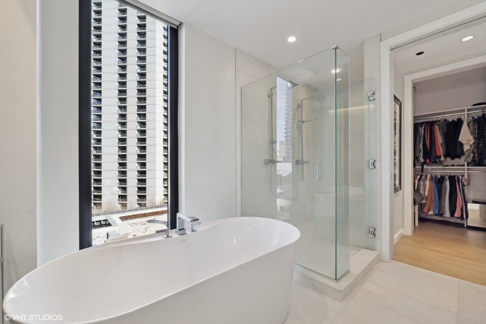 56 West Huron Street, Unit 6 Chicago, IL 60654 - Photo 30 of 32 a bathroom with a bathtub and a shower