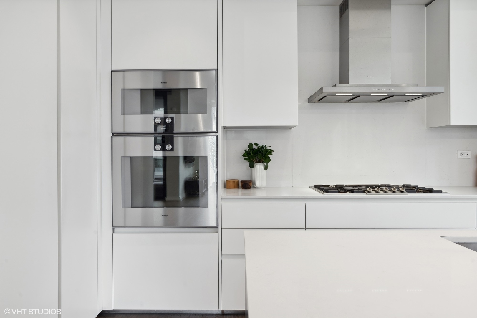 56 West Huron Street, Unit 6 Chicago, IL 60654 - Photo 9 of 32 a kitchen with stainless steel appliances granite countertop a sink and a refrigerator