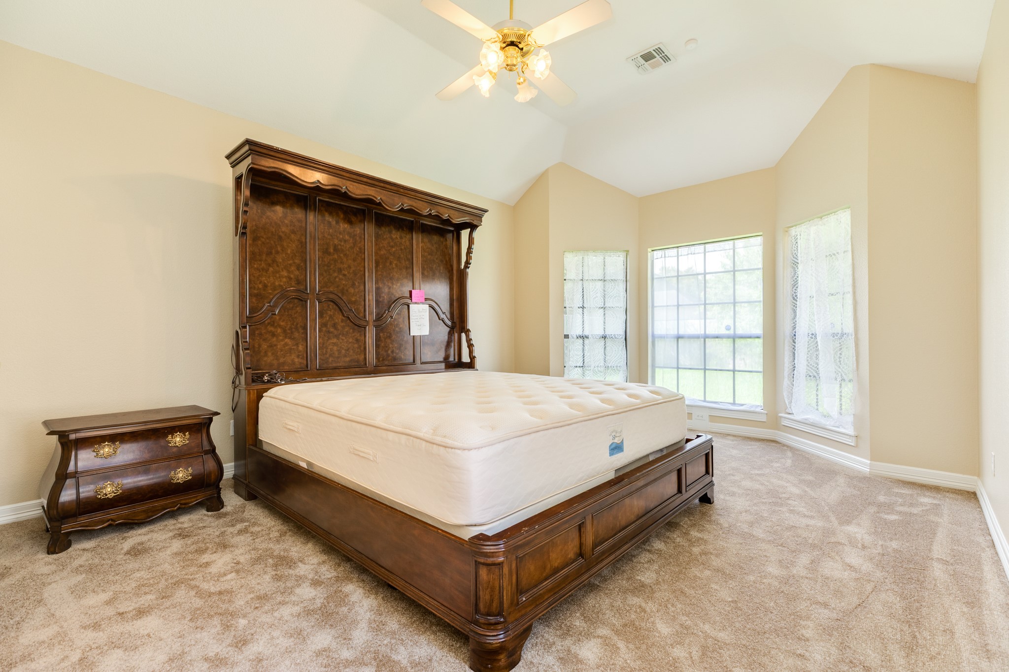704 Walnut Street Lake Jackson, TX 77566 - Photo 16 of 27 a bed sitting in a spacious bedroom next to a window