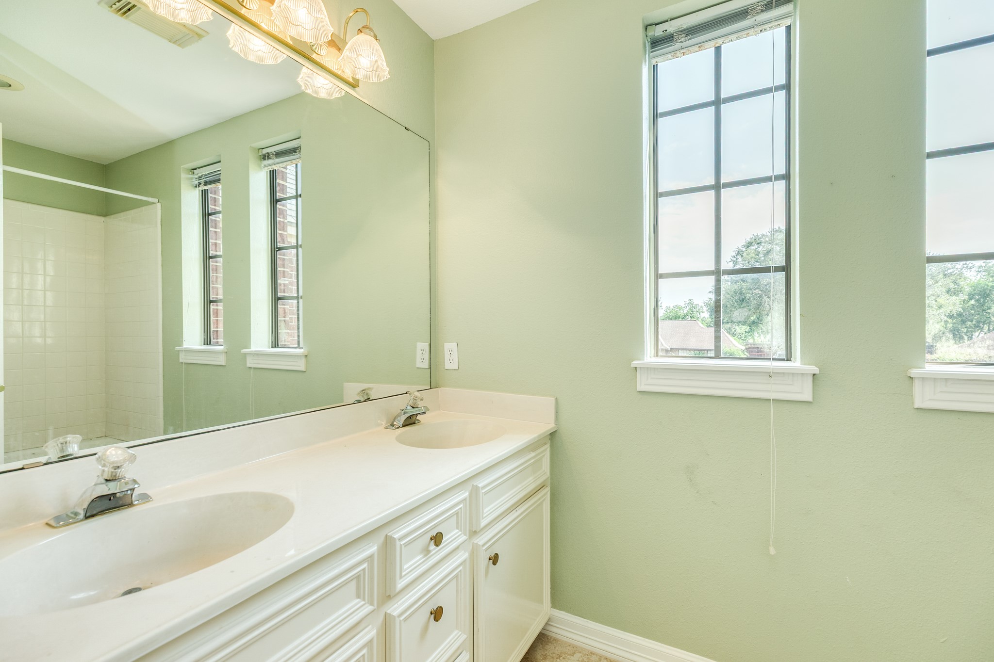 704 Walnut Street Lake Jackson, TX 77566 - Photo 23 of 27 a bathroom with a sink and a mirror
