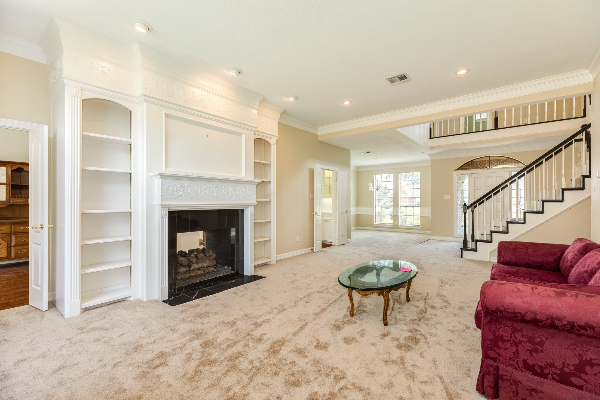 704 Walnut Street Lake Jackson, TX 77566 - Photo 6 of 27 a living room with furniture a window and a fireplace