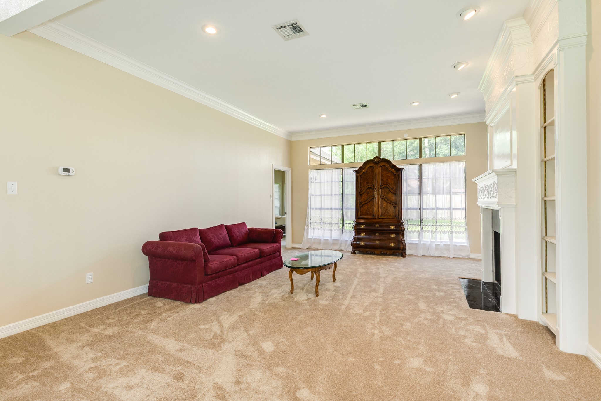 704 Walnut Street Lake Jackson, TX 77566 - Photo 8 of 27 a living room with furniture and a chandelier
