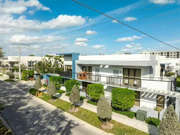 aerial view of a house with a yard