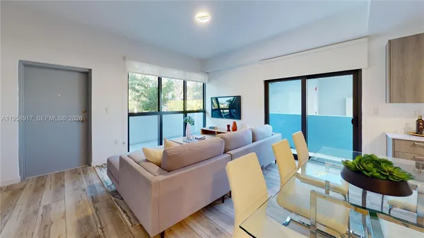 a living room with furniture and a large window