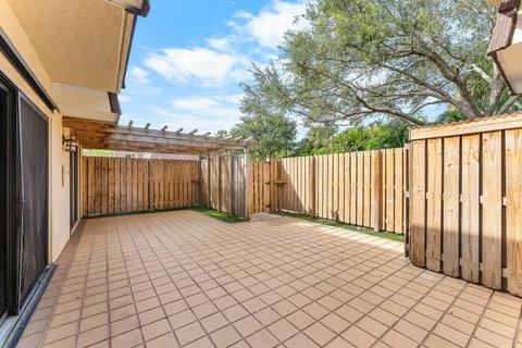 a view of a building with wooden fence