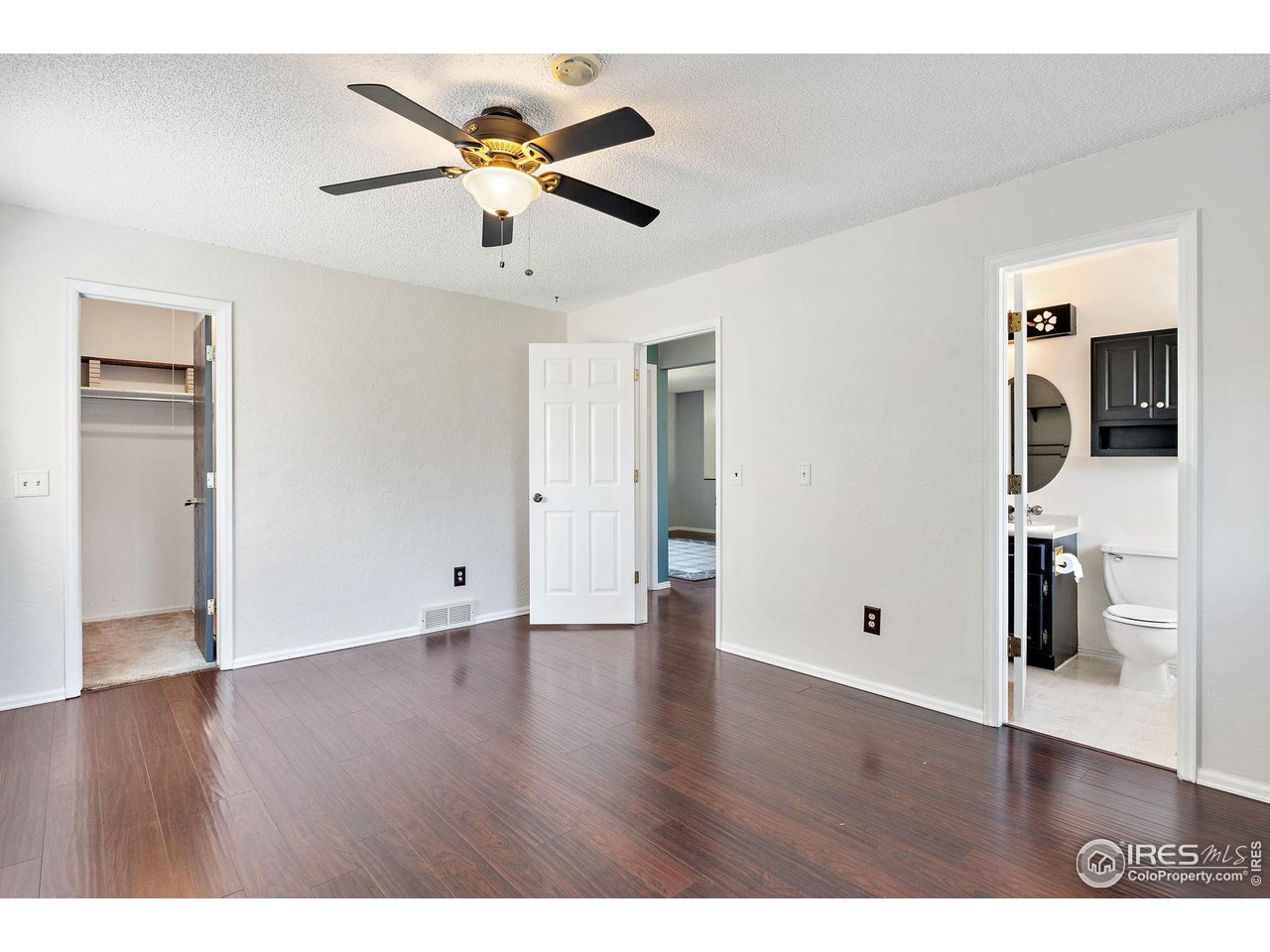 1305 Inverness Drive Lafayette, CO 80026 - Photo 14 of 41 a view of an empty room with wooden floor