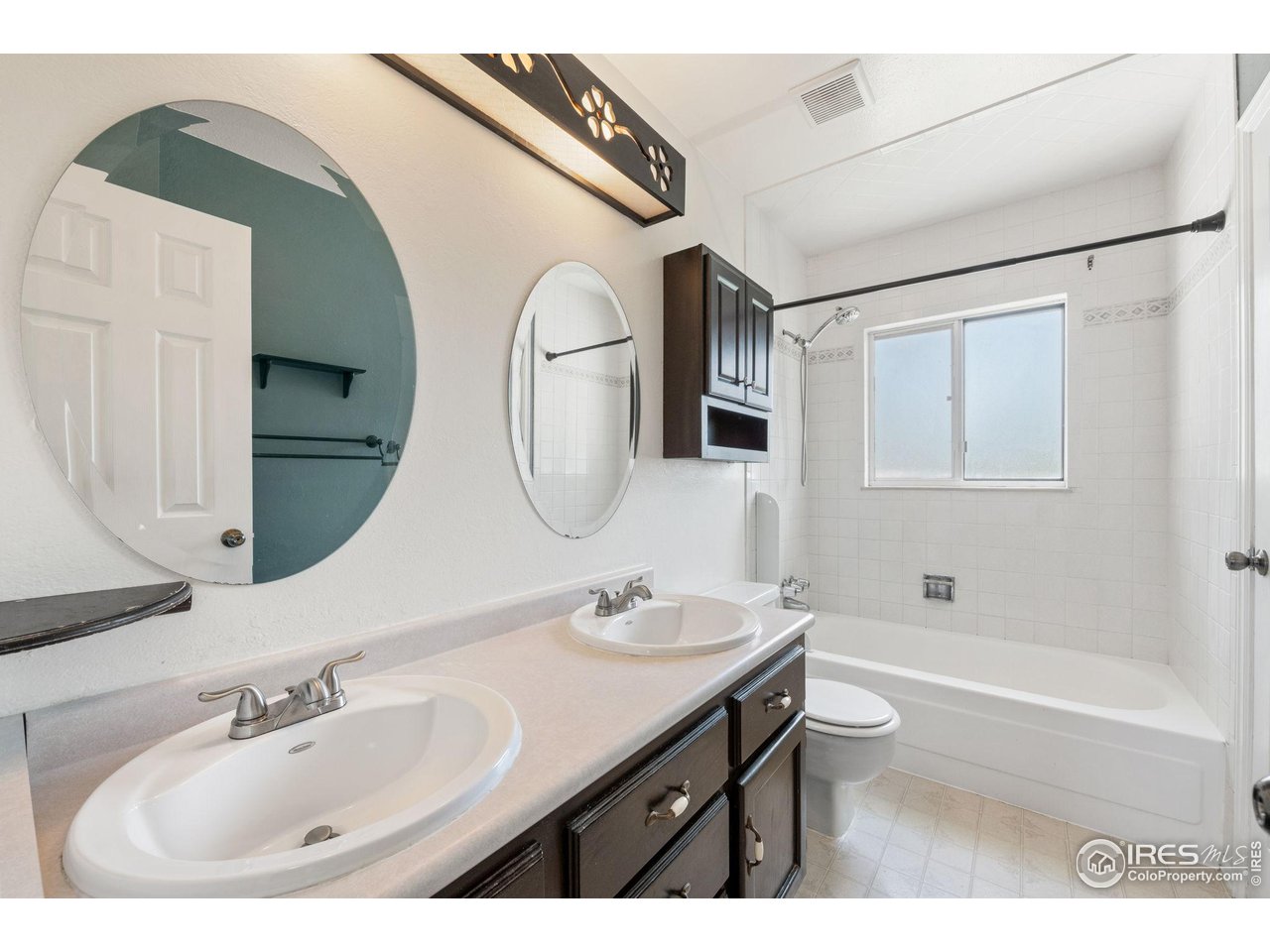 1305 Inverness Drive Lafayette, CO 80026 - Photo 15 of 41 a bathroom with a bathtub sink and mirror