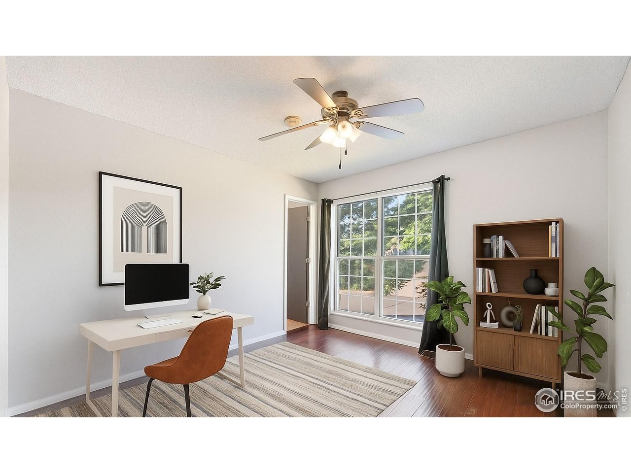 1305 Inverness Drive Lafayette, CO 80026 - Photo 21 of 41 a living room with furniture a window and a flat screen tv