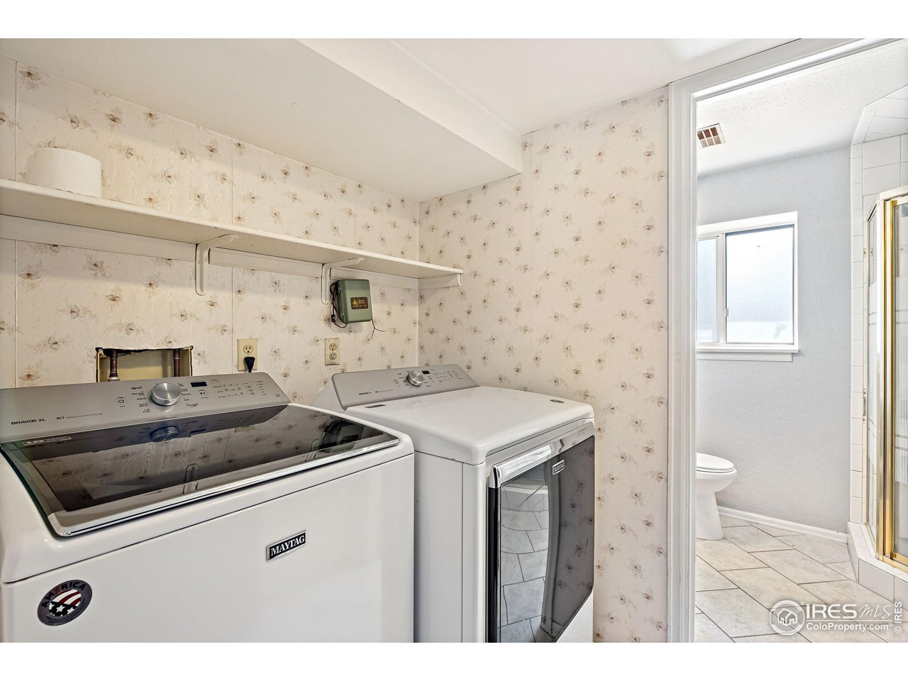 1305 Inverness Drive Lafayette, CO 80026 - Photo 26 of 41 a utility room with cabinets washer and dryer