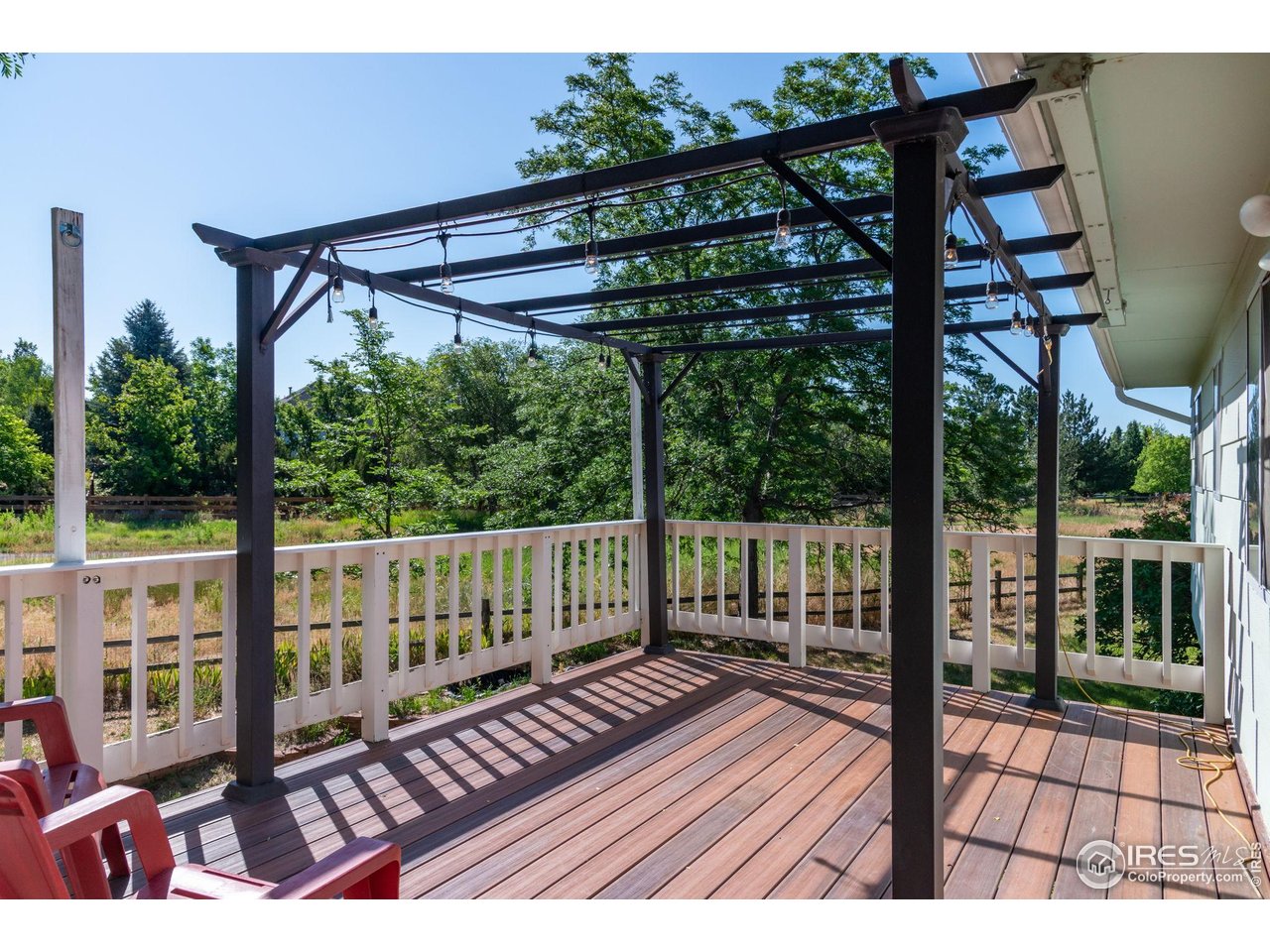 1305 Inverness Drive Lafayette, CO 80026 - Photo 33 of 41 a view of balcony with wooden floor and outdoor seating