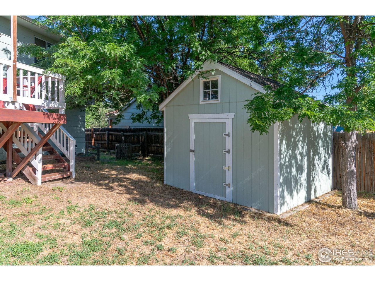 1305 Inverness Drive Lafayette, CO 80026 - Photo 35 of 41 a view of a small house with a tree in the background
