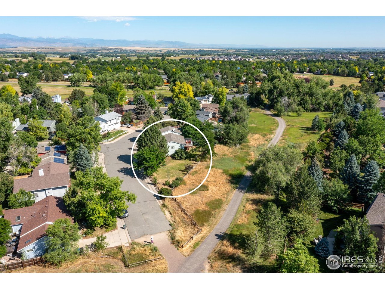 1305 Inverness Drive Lafayette, CO 80026 - Photo 39 of 41 an aerial view of a house with a lake view