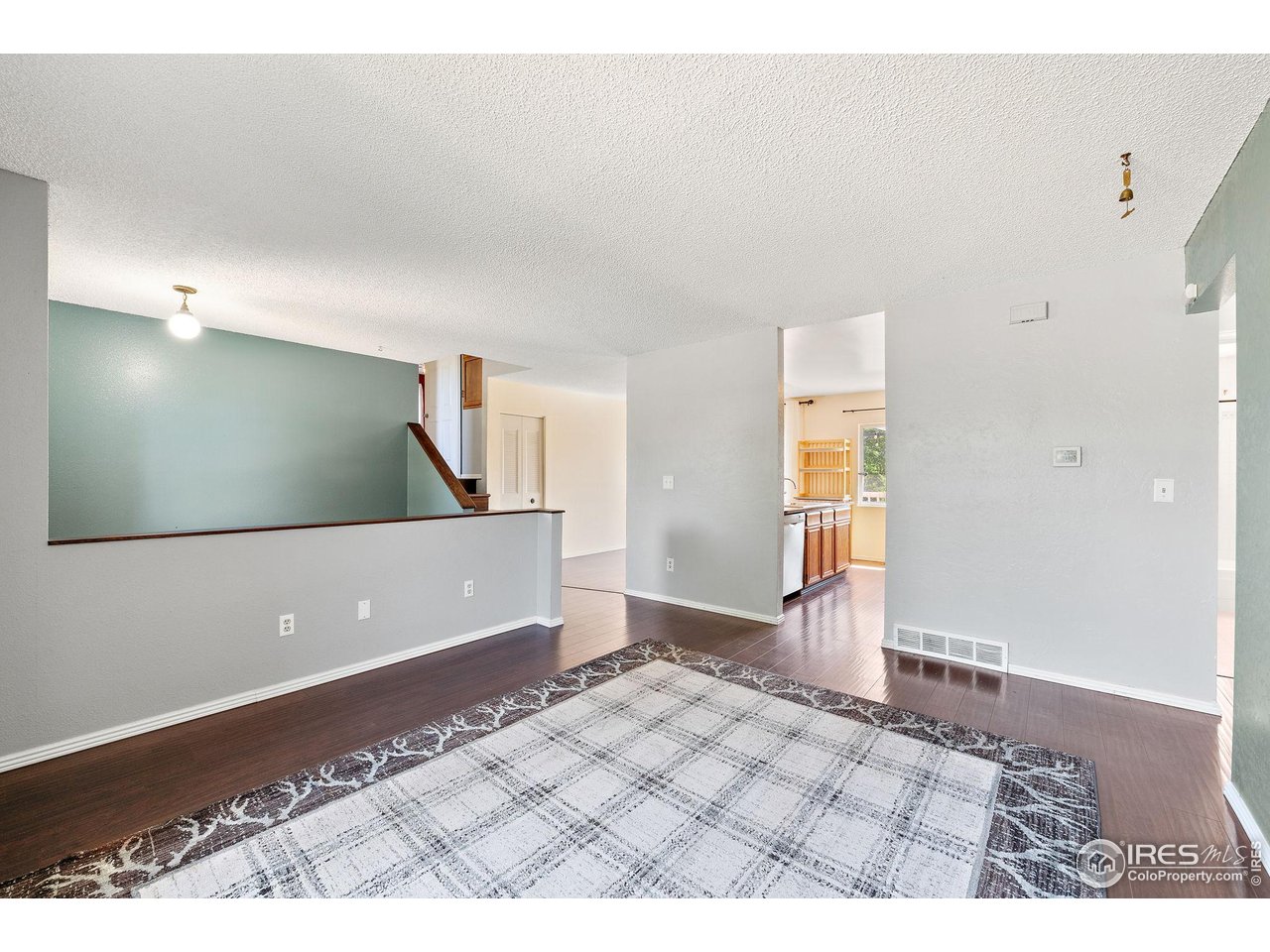 1305 Inverness Drive Lafayette, CO 80026 - Photo 7 of 41 a view of a big room with wooden floor and windows