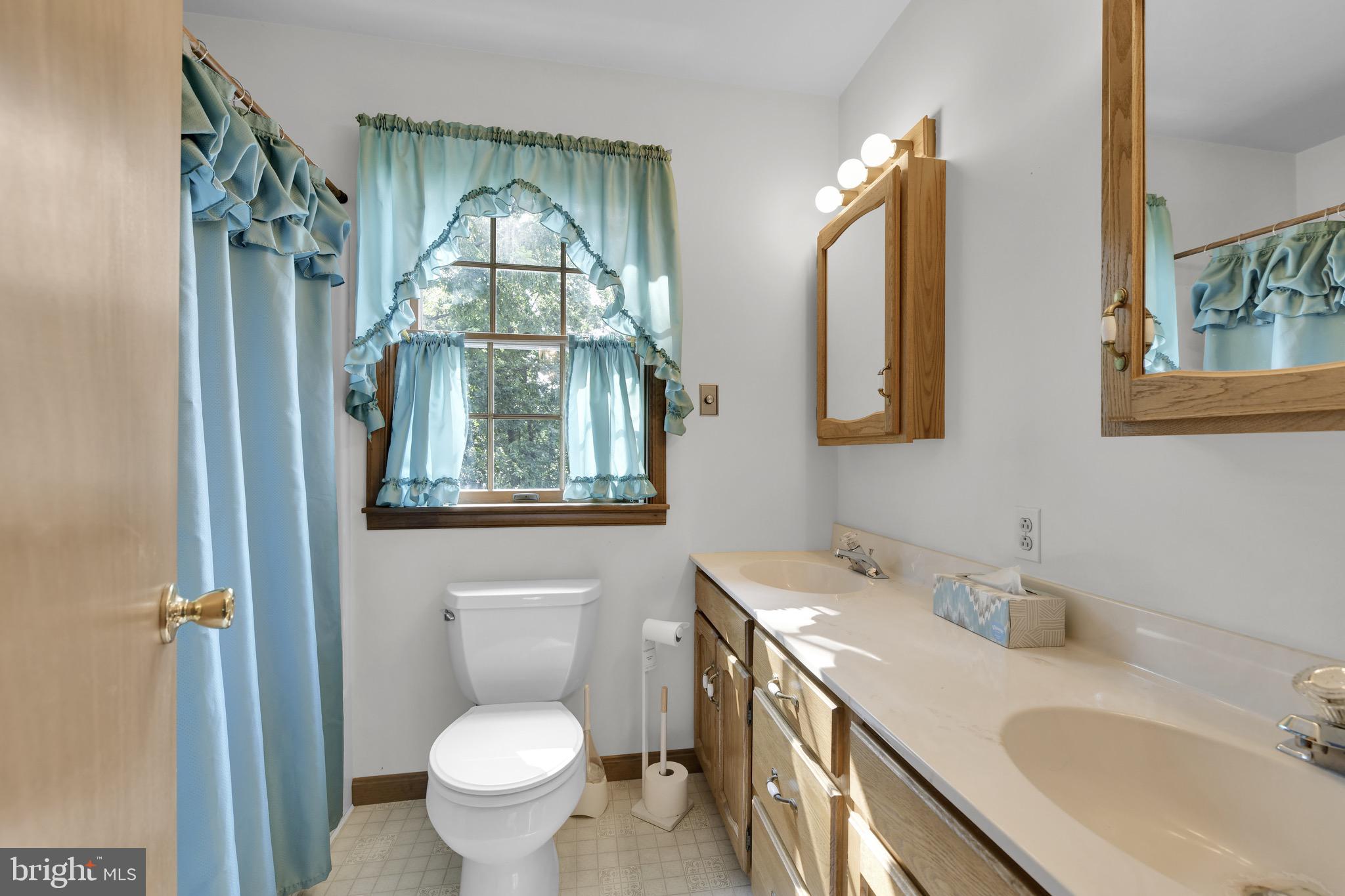 400 Reitnour Road Spring City, PA 19475 - Photo 17 of 52 a bathroom with a toilet sink and mirror