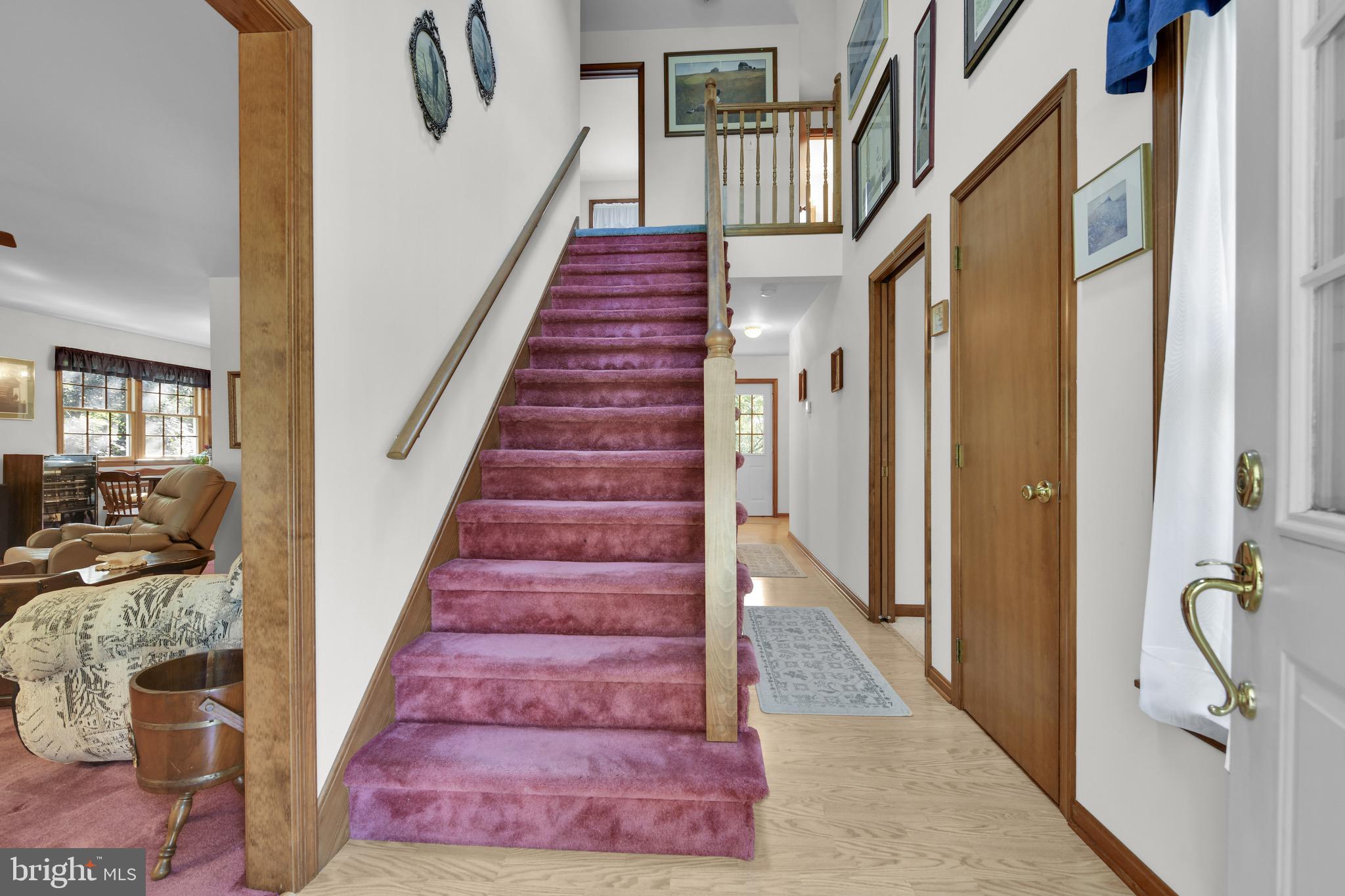 400 Reitnour Road Spring City, PA 19475 - Photo 4 of 52 a view of staircase with lots of frames on wall and windows