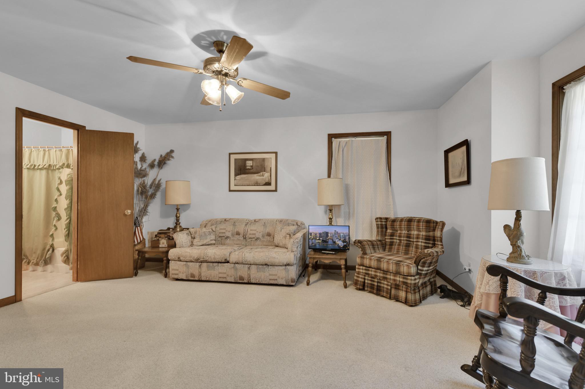 400 Reitnour Road Spring City, PA 19475 - Photo 41 of 52 a living room with furniture and paintings on the wall