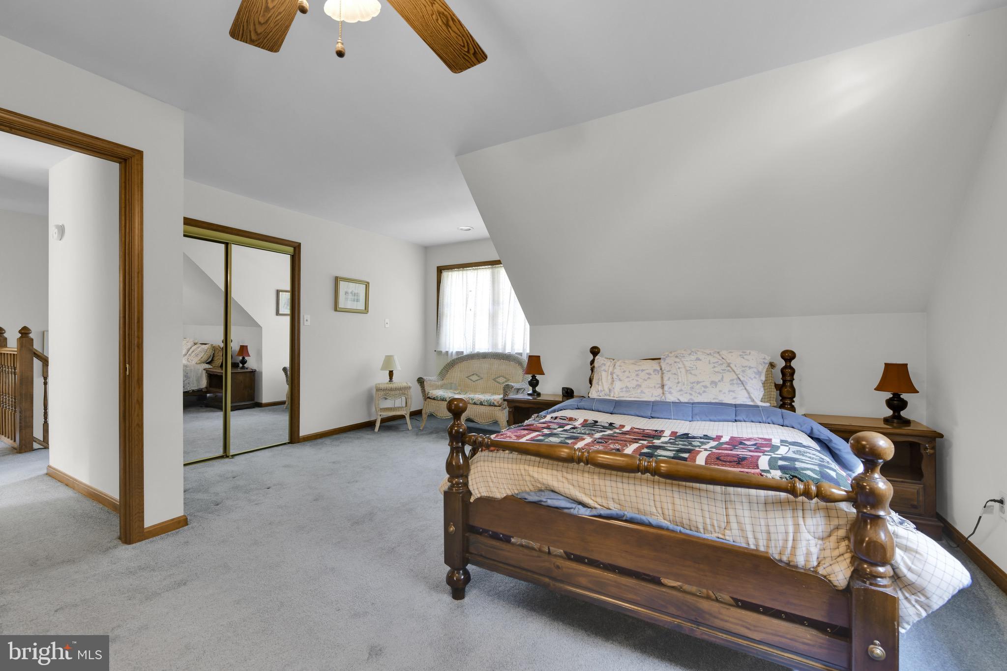 400 Reitnour Road Spring City, PA 19475 - Photo 42 of 52 a bedroom with a bed and a chandelier