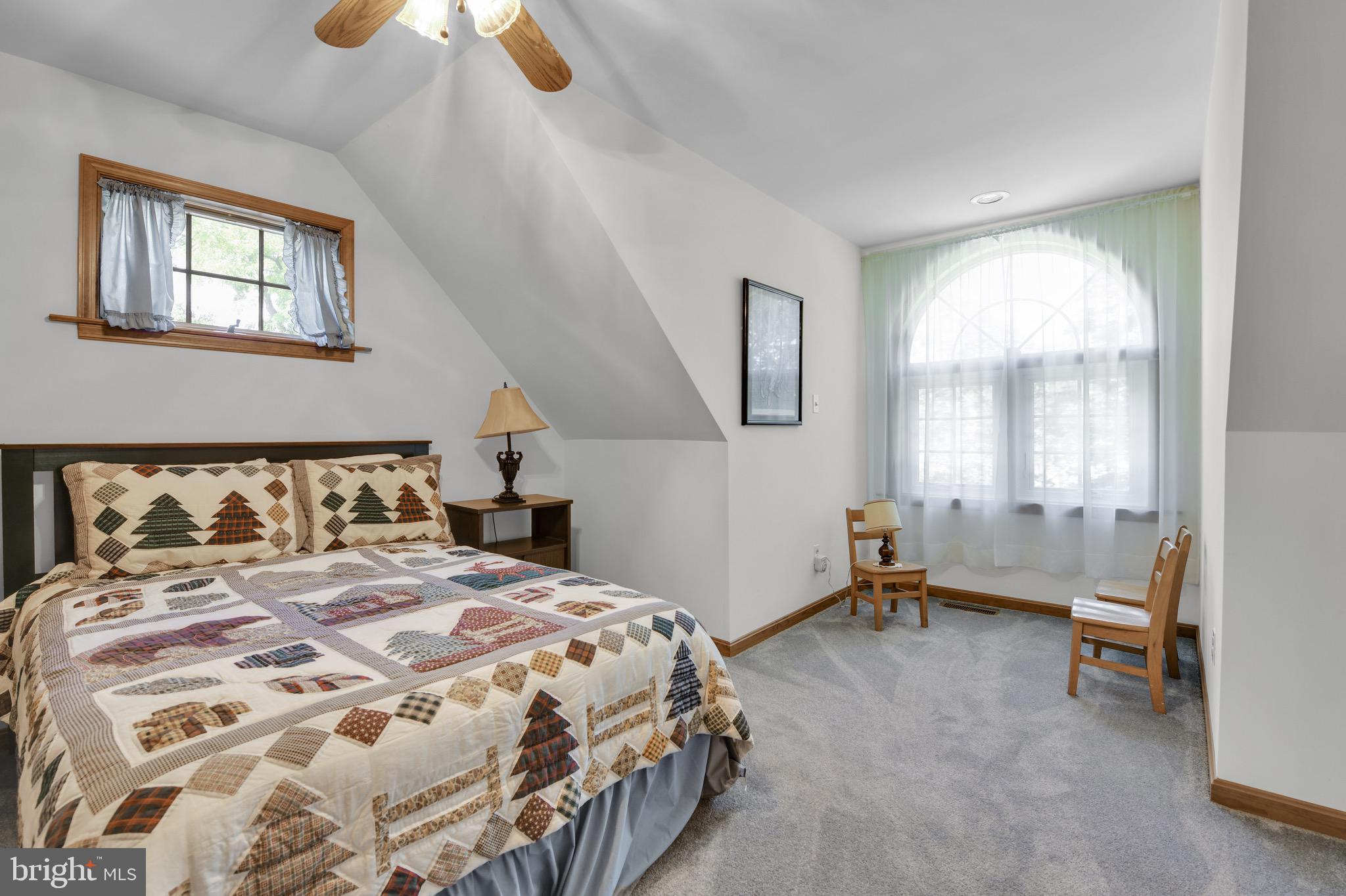 400 Reitnour Road Spring City, PA 19475 - Photo 43 of 52 a bedroom with a bed and a chair